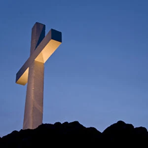 USA, Idaho, Caldwell. Lizard Butte cross is lit for a special event