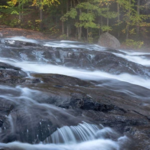 USA, New York State. Buttermilk Falls in autumn, Adirondack Mountains