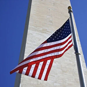 USA, Washington DC. American flag and the Washington Monument