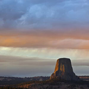 WY, Devils Tower National Monument, Storm at Sunset