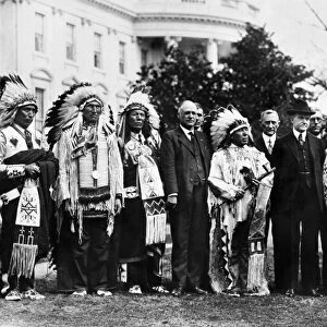 30th President of the United States. Coolidge (with hat) welcoming representatives of the Sioux tribe to the White House, 1925