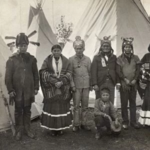APACHE GROUP, 1904. Chief Geronimo (center) with a group of Apache men and women. Photographed at the 1904 Worlds Fair in St. Louis, Missouri