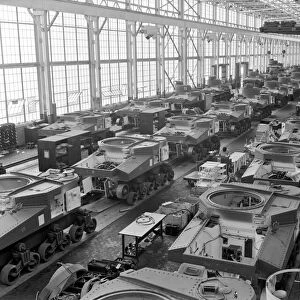 Assembly line production of M3 tanks at a Chrysler plant in Detroit, Michigan, during World War II. Photographed by Alfred T. Palmer, c1944