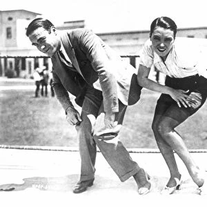 CHARLESTON DANCE, 1925. Frank Farnum, who popularized the Charleston, coaching