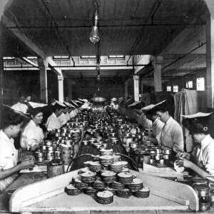 CHICAGO: MEATPACKING. Factory workers labeling cans of the Veribest products in the Armour