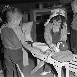 DAYCARE, 1943. Catherine Simmons playing Red Cross nurse at the Bella Vista Nursery