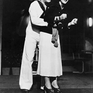 ETHEL MERMAN (1908-1984). American actress and singer. Photographed with co-star William Gaxton during a Broadway performance of Cole Porters musical Anything Goes, 1934