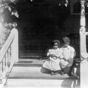 GEORGIA: CHILDREN, c1900. Two African-American children sitting on the porch of