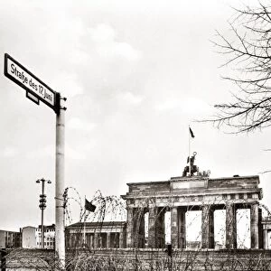 GERMANY: BERLIN, c1961. The Brandenburg Gate with barbed wire in the foreground. Photographed c1961