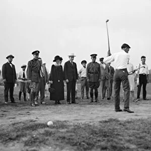 GOLFING, 1924. President Calvin Coolidge and his wife Grace watching a golf game