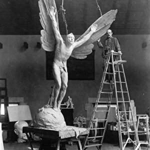 GUTZON BORGLUM (1867-1941). American sculptor. Borglum with his sculpture, Statue of Aviator