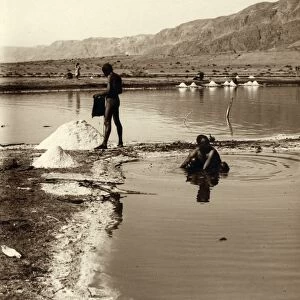 HOLY LAND: DEAD SEA. Two men collecting salt from the Dead Sea. Photograph, c1920