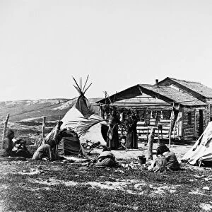 INDIAN CAMP, c1900. Native Americans at their camp, possibly Cree. Photograph, c1900
