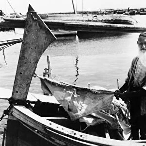 ITALY: FISHERMAN, 1943. An 74 year-old fisherman in Palermo, Sicily; fishing is