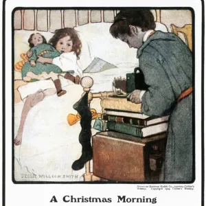 KODAK ADVERTISEMENT, 1904. A Christmas Morning. Advertisement for a Kodak hand-held camera, from an American magazine, 1904