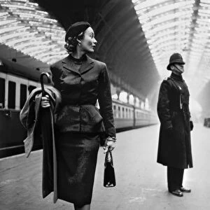 LONDON: MODEL, 1951. Fashion model Lisa Fonssagrives at Paddington Station, London, England