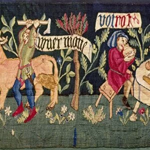 MEDIEVAL MEAL. A medieval tapestry showing two men at a meal and the slaughtering of a cow