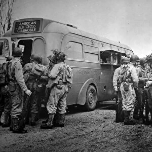 RED CROSS: CLUBMOBILE. American Red Cross clubmobile serves coffee, doughnuts, and other items to soldiers in isolated training camps. Photographed c1942