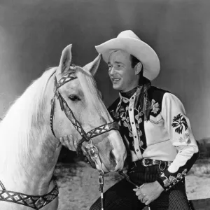 ROY ROGERS (1912-1998). Leonard Slye. American singing cowboy actor. Photographed with his horse Trigger