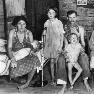 SHARECROPPER FAMILY, 1936. Bud Fields and his family, in Hale County, Alabama