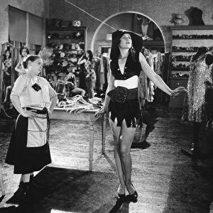 SILENT FILM STILL: FASHION. Daphne Pollard and Ardith Grey in a scene from The Girl from Everywhere, 1927
