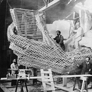 STATUE OF LIBERTY, 1883. The Statue of Liberty under construction in Paris, c1883. Its sculptor, Frederic Bartholdi, stands second from right