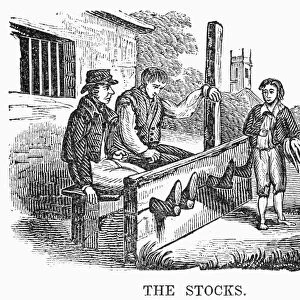 IN THE STOCKS. Men sitting in the stocks in Colonial America. American wood engraving, 1838