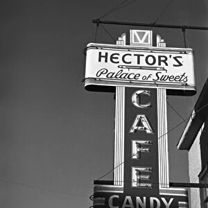 SWEET SHOP SIGN, 1937. Hectors Palace of Sweets, cafe sign in Crosby, North Dakota. Photograph by Russell Lee, November 1937