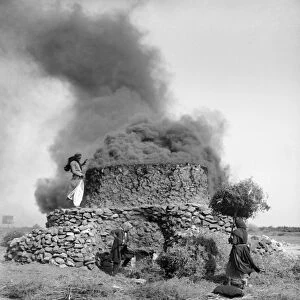 SYRIA: KILN, c1910. Burning thorns in a lime kiln in Homs, Syria. Photograph, c1910