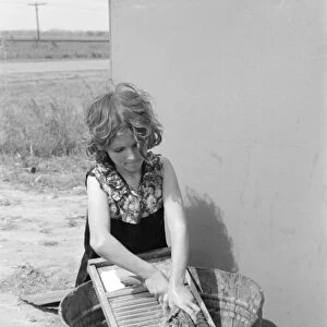 TEXAS: MIGRANT GIRL, 1939. A young girl from a family of migrant workers doing