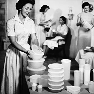 TUPPERWARE PARTY, 1950s. A Tupperware party in an American home. Advertising photograph, 1950