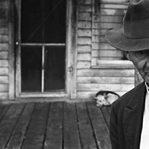 UNEMPLOYED MINER, 1935. An unemployed miner in the deserted mining town of Zinc, Arkansas