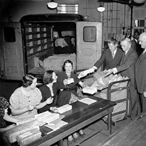 UNEMPLOYMENT CENSUS, 1937. Census directors John D. Biggers, William L. Austin and Frederick A. Gosnell give final instructions to female clerks receiving completed questionnaires from the Unemployment Census of 1937. Photograph, 24 November 1937