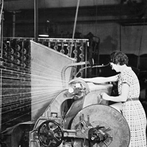 WOMAN TEXTILE WORKER, 1937. Photographed by Lewis W. Hine, c1937