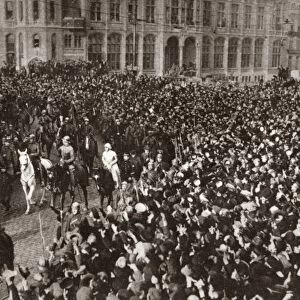 WORLD WAR I: GHENT, 1918. King Albert, Queen Elizabeth and Prince Leopold leading