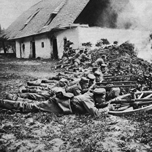 WWI: GERMAN RIFLEMEN, c1915. German riflemen behind makeshift defenses. Photograph