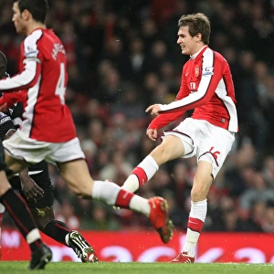 Aaron Ramsey shoots past Stoke goalkeeper Thomas Sorensen to score the 2nd Arsenal goal