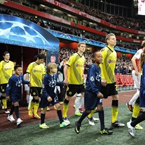 Arsenal FC vs. Borussia Dortmund: Player Escorts in Champions League Showdown at Emirates Stadium (2011-12)