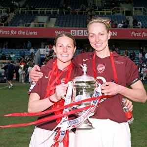 Arsenal Ladies Celebrate FA Cup Victory: Kelly Smith and Faye White Hold the Trophy after 5-0 Win over Leeds United Ladies