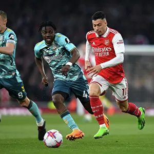 Arsenal vs. Southampton: Gabriel Martinelli Fights for Possession in Premier League Clash