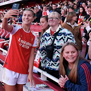 Arsenal Women's Team Celebrates Thrilling Victory over Aston Villa with Elated Fans at Emirates Stadium