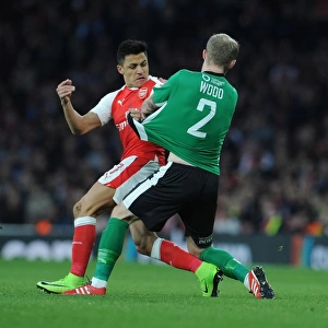 Arsenal's Alexis Sanchez Clashes with Lincoln's Bradley Wood in FA Cup Quarter-Final