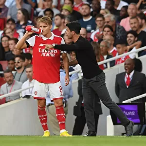 Arsenal's Arteta Gives Instructions to Odegaard During Arsenal v Fulham Premier League Clash (2022-23)