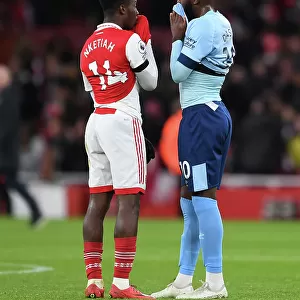 Arsenal's Eddie Nketiah and Brentford's Josh Dasilva Share a Moment After Arsenal FC vs Brentford FC in Premier League