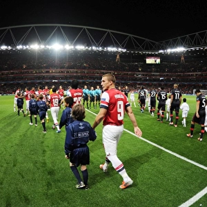 Arsenal's Podolski Readies for Olympiacos Clash at Emirates Stadium