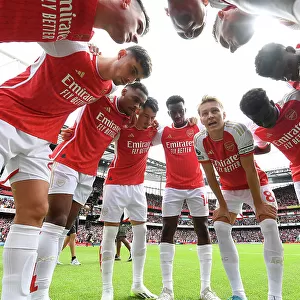 Arsenal's Pre-Match Huddle: Martin Odegaard Leads the Team against Nottingham Forest (2023-24)