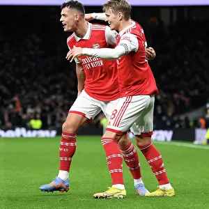 Arsenal's Unstoppable Duo: Odegaard and Xhaka Celebrate Thrilling Victory Over Tottenham in the Premier League 2022-23