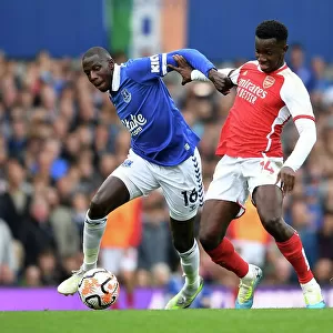 Battle for Possession: Everton's Doucoure vs. Arsenal's Nketiah in the 2023-24 Premier League Clash