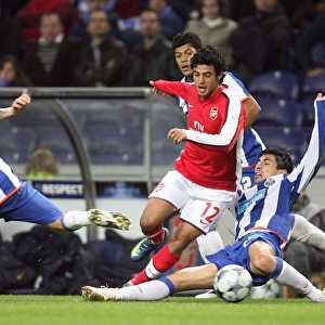 Carlos Vela (Arsenal) Fucile & Raul Meireles (FC Porto)