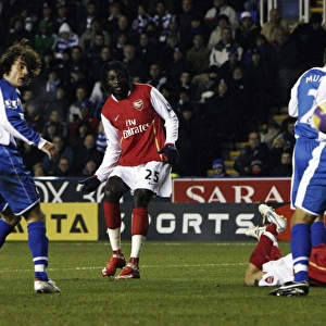 Emmanuel Adebayor shoots past Reading goalkeeper Marcus Hahnemann to score the 2nd Arsenal goal